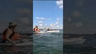 Sea kayaking group during kayak camping weekend at sea