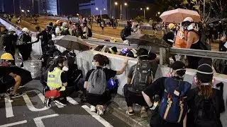 Hong Kong protesters face off with police on umbrella movement anniversary