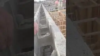 Showing Masonry  Fire Rated Wall inside rebar filled before full pour Concrete