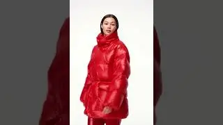 Red modern branded down jacket, puffy down voluminous jacket. Red varnish pants.