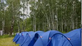 Camping in nature. The tent city. Blue tents in nature