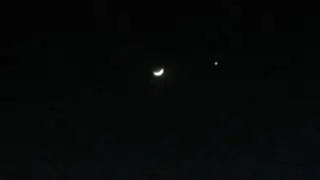 beautiful site moon next to a star