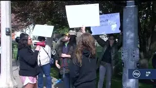 Protestors gather outside Carroll County Sheriff's Office after hiring of Myles Cosgrove