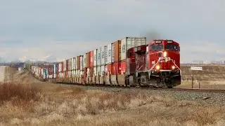 SUPER FAST!!!! CP 8022, CP 8940 and CP 9829 lead CP 148 east at Strangmuir, Alberta