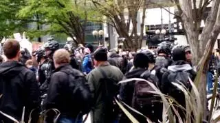 Seattle police arrest ANTIFA protester in Westlake Park in Seattle