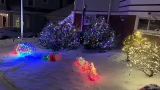 Christmas lights in Diamond District neighborhood of Lynn, MA during snowfall