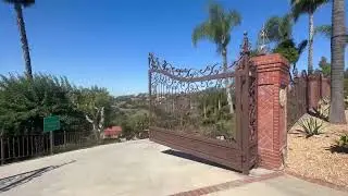 Ornamental Vehicle Gate - Motorized Double Swing, Forged, Textured Bronze Finish and floral elements