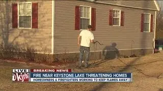 Crews battle wild fire near Keystone Lake community