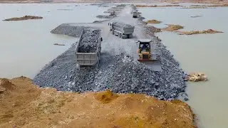 exquisite surface space in the deep pit is being road construction using dump truck and bulldozer
