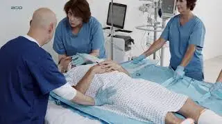 Lateral transfer from bed to Sara Combilizer using MaxiSlide | Early Mobility | Arjo Global