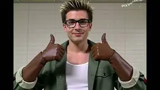 Tony Ivan Feeling His Throat with His Brown Gloves 