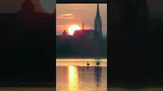 Sunset on Main river. St. Mauritius church. Frankfurt (Germany) 08.03.2025