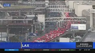 Travel rush underway at LAX as 215,000 expected to pass through airport