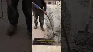 Demonstration of the use of concrete vibrator after concrete pouring at the construction site