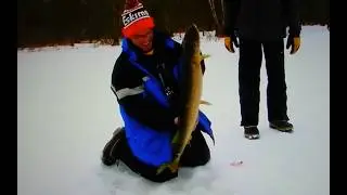 Gant Outdoors. Ice fishing a slough of the Wisconsin River. Spring Green Wisconsin area.