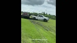 Cummins playing in mud while hooked to a gooseneck