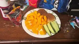 Mini Cheeseburgers, Cheeto Puffs, Orange Slices, Cucumbers, and Cherry Kool-Aid Jammer Juice