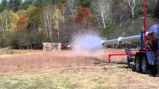 American Chunker fires dual pumkins at wooden baracade