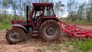 Tractor Cutting and Collecting Hay on the Farm