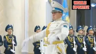 The Kazakhstan military plays the Russian national anthem in honor of President Putin.