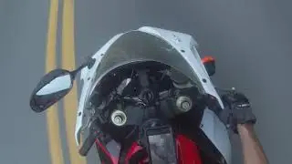 guy throws a water bottle at biker