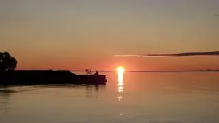 SUNRISE view over Lake Ontario, Balmy Beach, Toronto.