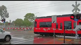 MTS Orange Trolley #railroadcrossing In Rain Shower (Euclid Avenue Station)