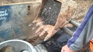 Placing concrete on the pipe collar