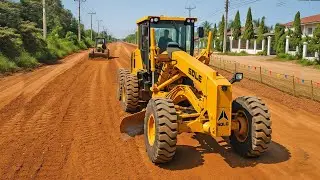 Close-Up View of a Yellow Motor Grader Leveling Red Dirt on a Semi-Urban Roadway
