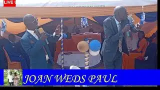JOAN WEDS PAUL