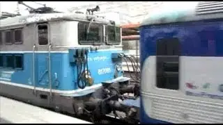France: SNCF Electric class 17000 locomotive departs Paris Gare du Nord passing a 9 car Z6100 EMU