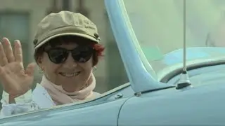 Hundreds of vintage cars parade through streets of Paris