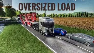 transporting an oversized seeder in a narrow road. FS19