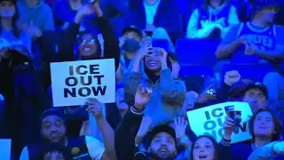 Timberwolves fans receive cheers from the local crowd when they show their ICE OUT NOW signs