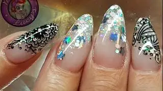Acrylic nails with embedded glitter and stamping