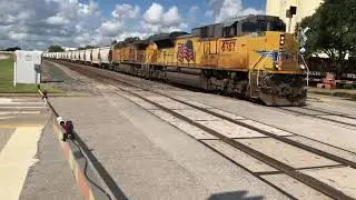 Short UP EB grain hopper train on brooks street (gate perspective)