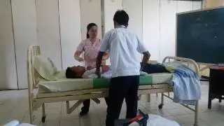 Lifting the patient using cotton drawsheet