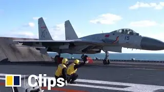 Chinese PLA Navy crew on the aircraft carrier Liaoning conduct training exercises