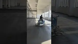 Check out the **ride-on power trowel** in action at the construction site!