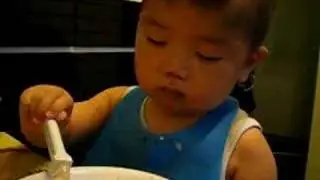 sleepy baby eating