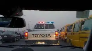 Police-Escort to the Airport through normal Thursday evening traffic in Lagos/Nigeria/Africa