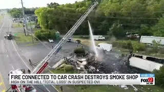 Fire connected to car crash destroys smoke shop
