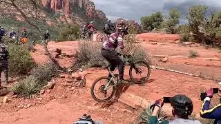 Jeff Lenosky Trailboss clearing a big step using a punch move at Sedona MTB festival SLO MO