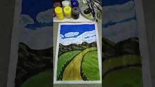 A winding countryside path leading through green fields and hills under a bright blue sky.