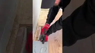 the measurement stage on a wooden board that will be cut and installed on the floor of the house