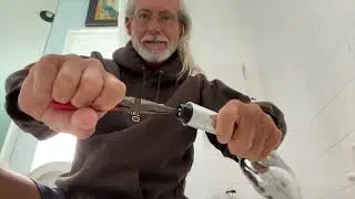 How to remove a water restrictor from a shower head