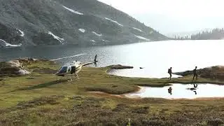 Travellers exiting helicopter in Wells Gray Provincial Park