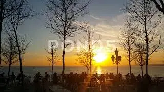 145818057 Sunset Tree And People Silhouettes Street Lamp