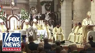 Worshippers gather in Bethlehem for midnight Mass