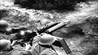A hidden gun emplacement and Swedish troops fire with guns to forestall Nazi move...HD Stock Footage